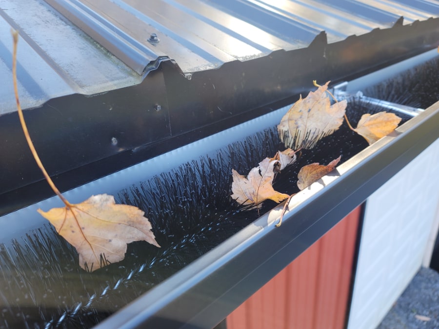 Image showing LeafBlox in a gutter with a few scattered leaves.