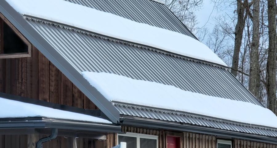 Residential Cabin with Snow Rail Installed On PBR Roof