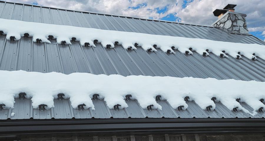Residential Cabin with Snow Guards Installed On PBR Roof