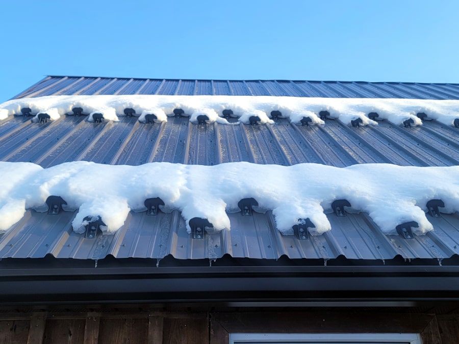 A Properly SnowCatcher Kodiak Snow Guard Installation With Multiple Rows Holding Back Snow