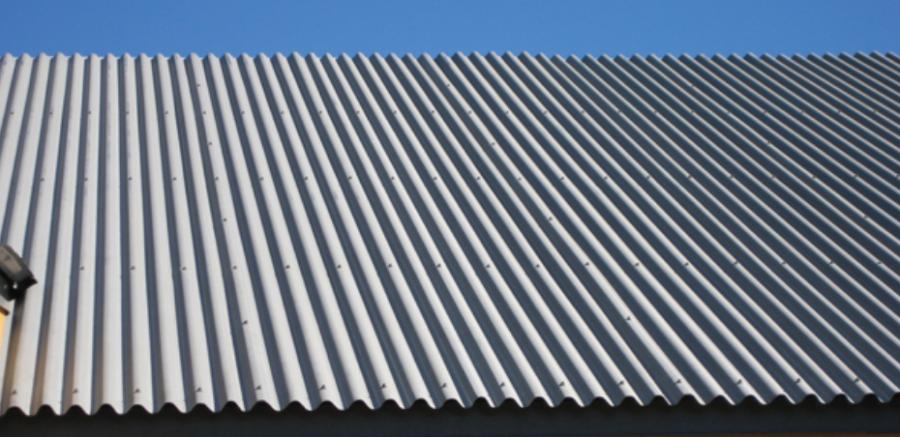 Galvanized Wavy Corrugated Roof mounted on building - Image courtesy of https://www.diyroofs.com/