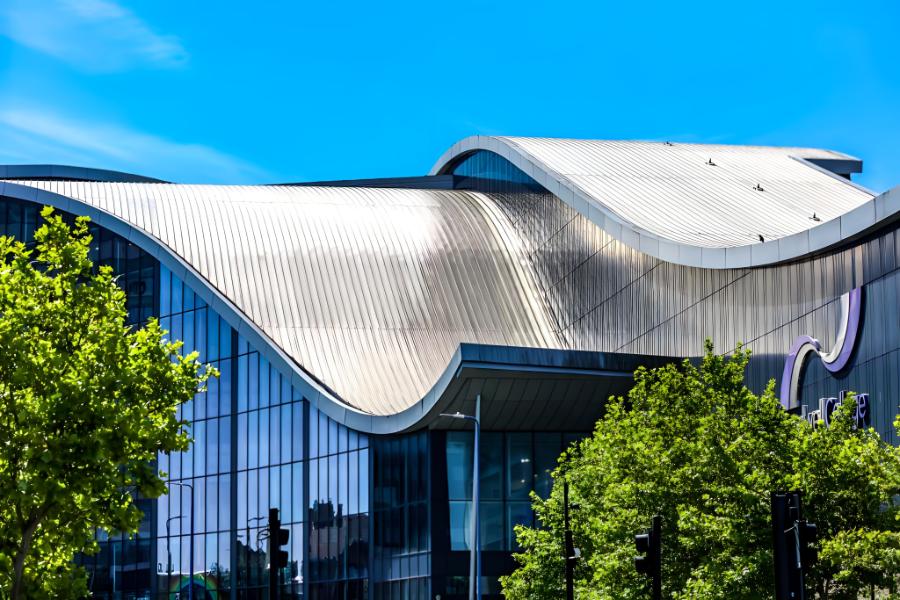 Ash & Lacy Installed Roofing on Curved Radius Roof - Image courtesy of https://www.ashandlacy.com/products/standing-seam/