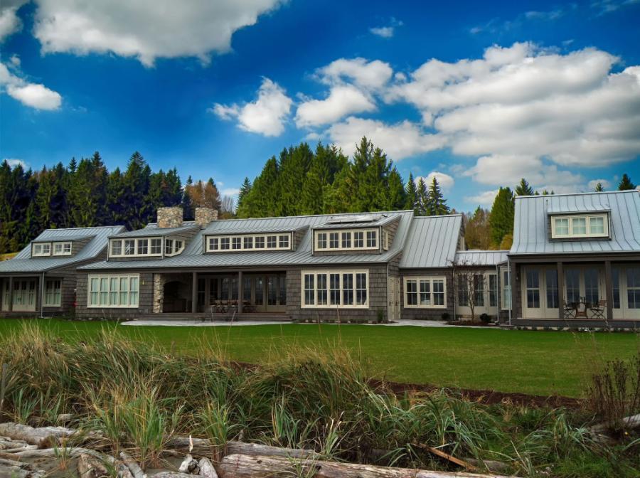 The Bryer Company Standing Seam Roof Installed On Home - Image courtesy of https://www.thebryercompany.com/