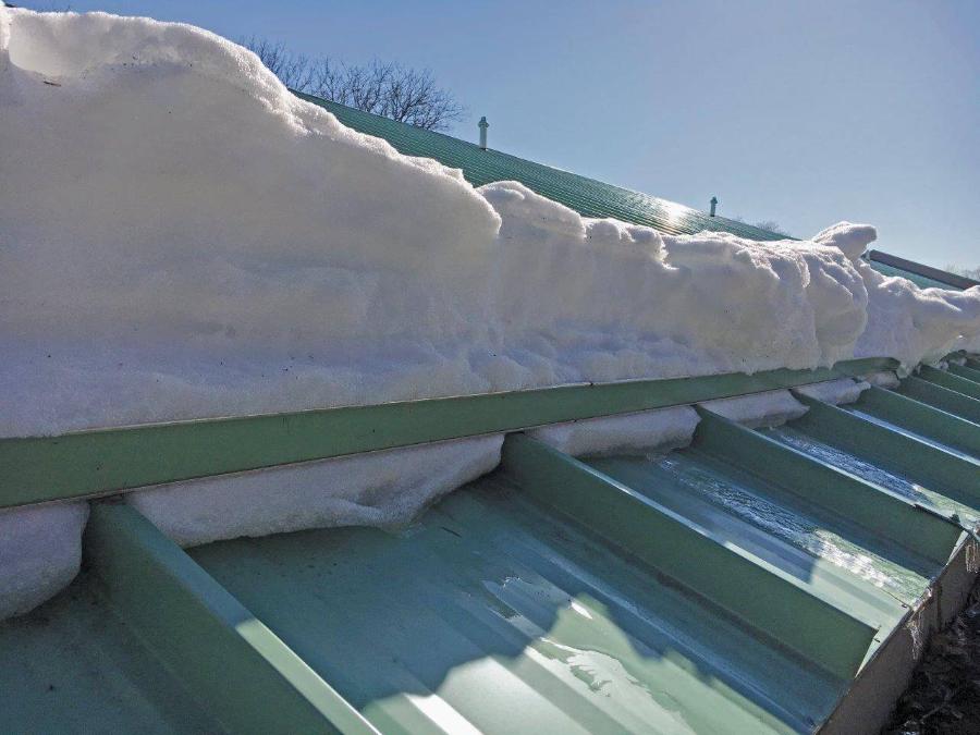 ColorBar mounted on Ceco Building Systems Standing Seam Roof holding snow - Image courtesy of https://www.cecobuildings.com/