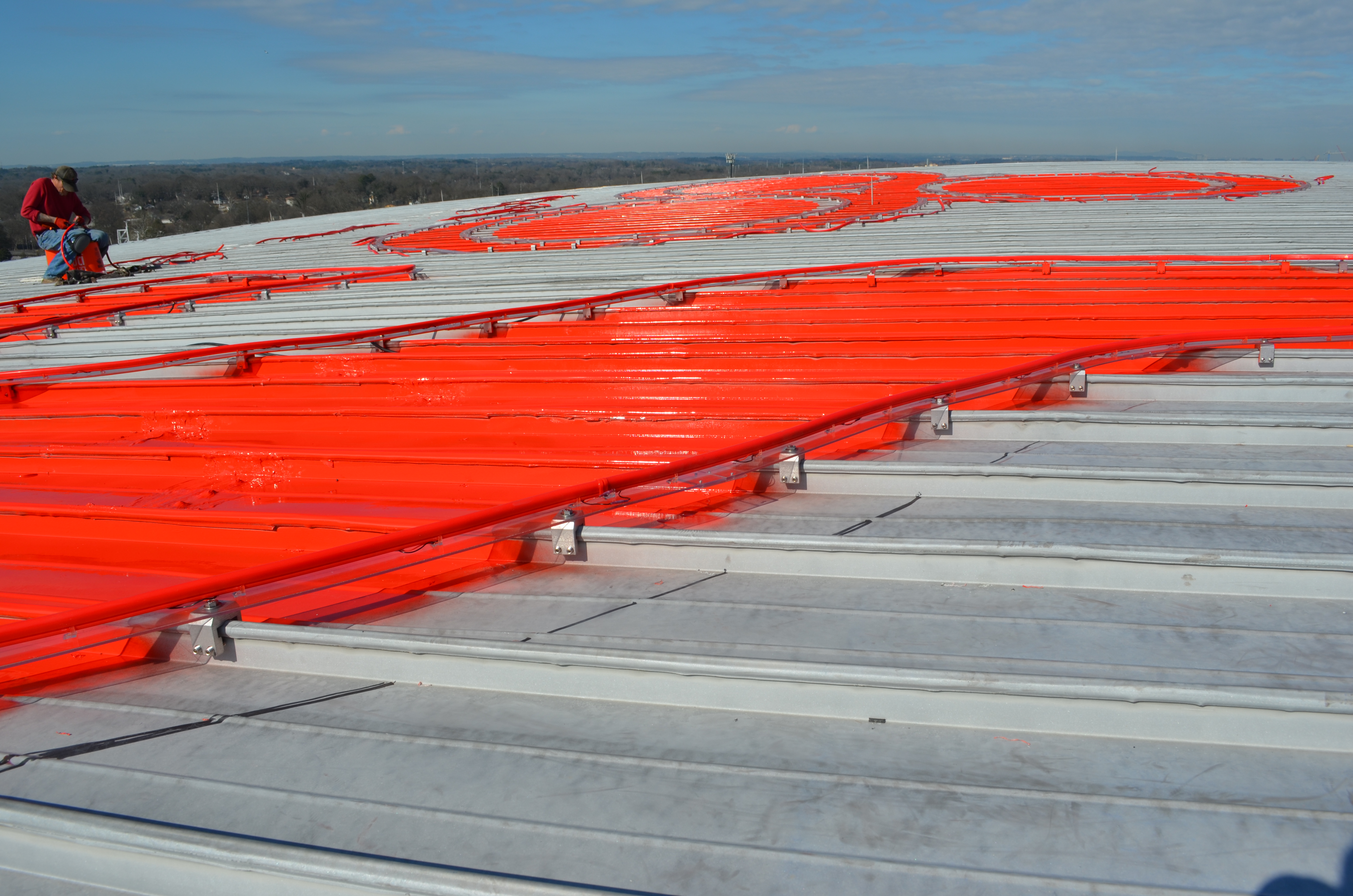 Contractor installs Neon lighting on state farm arena in Atlanta with RoofClamp RCT