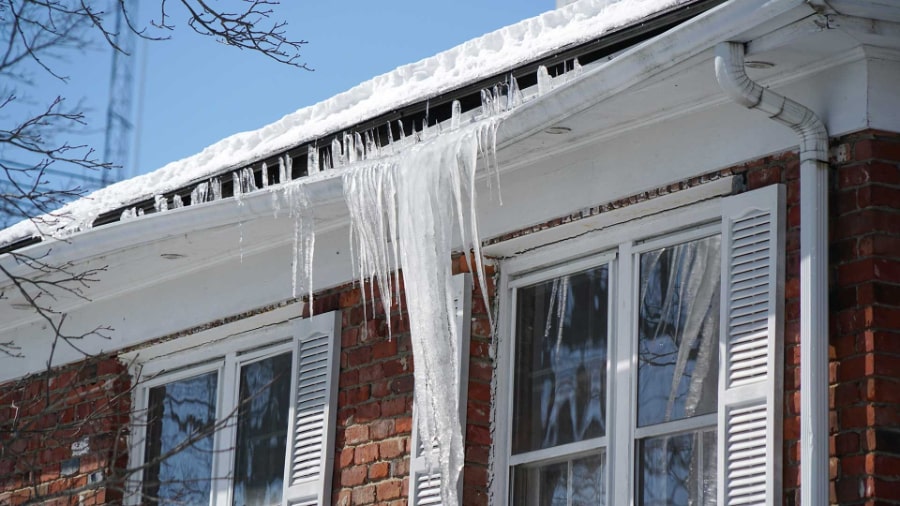 Damaged Gutters With Dangerous Icicles - Image Courtesy of firstforwomen.com