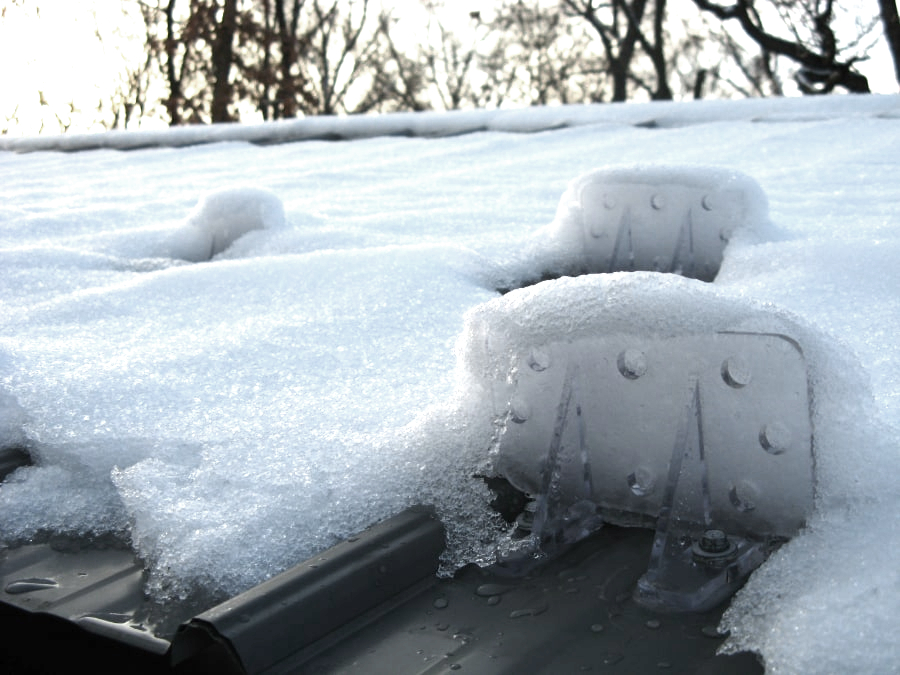 Image showing Snojax 1 Snow Guards Mounted On A Roof and Holding Snow