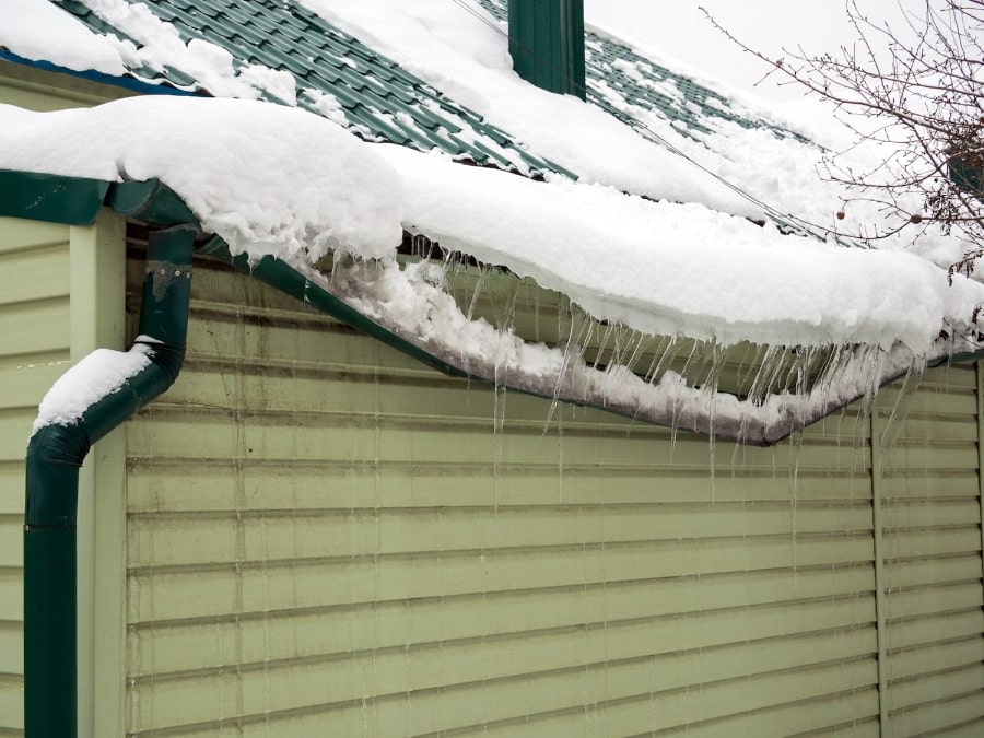 Snow and Ice Ripping Gutters From The Roof - Image Courtesy of johnsonrestoration.net