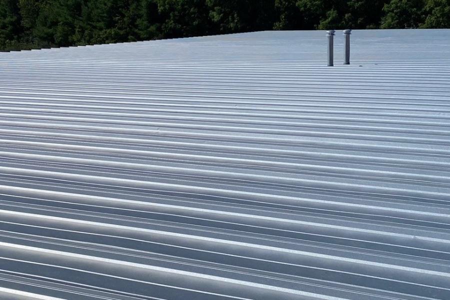 Miller Steel Buildings standing seam roof installed on warehouse - Image courtesy of https://www.millerbldgs.com/