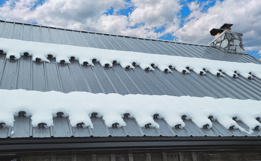 Color-Matched Powder-Coated SnowCatcher Kodiak Snow Guards Holding Snow on a Roof