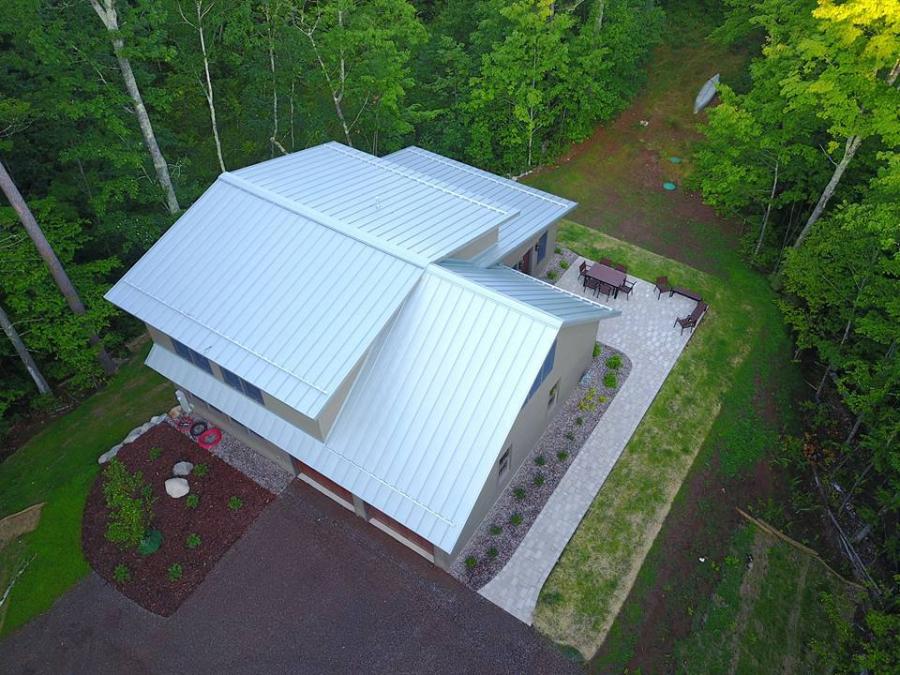 Sheet Metal Supply LTD (SMS) standing seam roof installed - Image courtesy of https://sheetmetalsupplyltd.com/