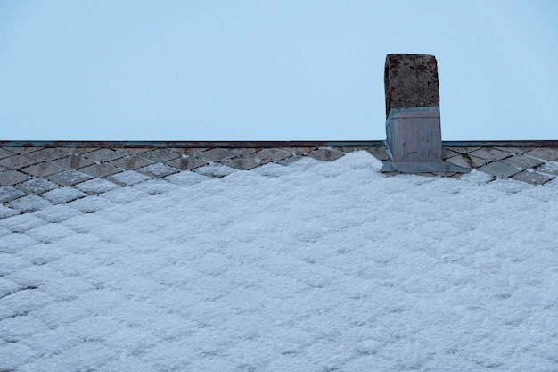 Image showing light amount of snow on fish scale shingle roof