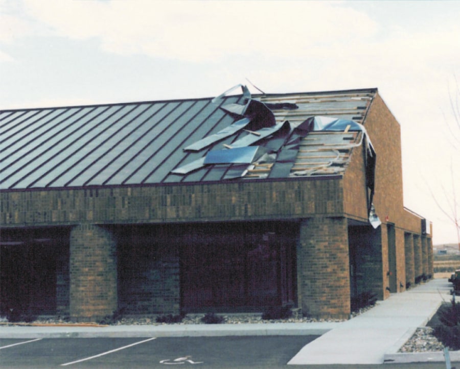 IMage showing metal roof panel ripped from roof by heavy winds